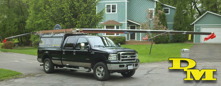 DM Services Inc branded truck parked at a job site in Minnesota